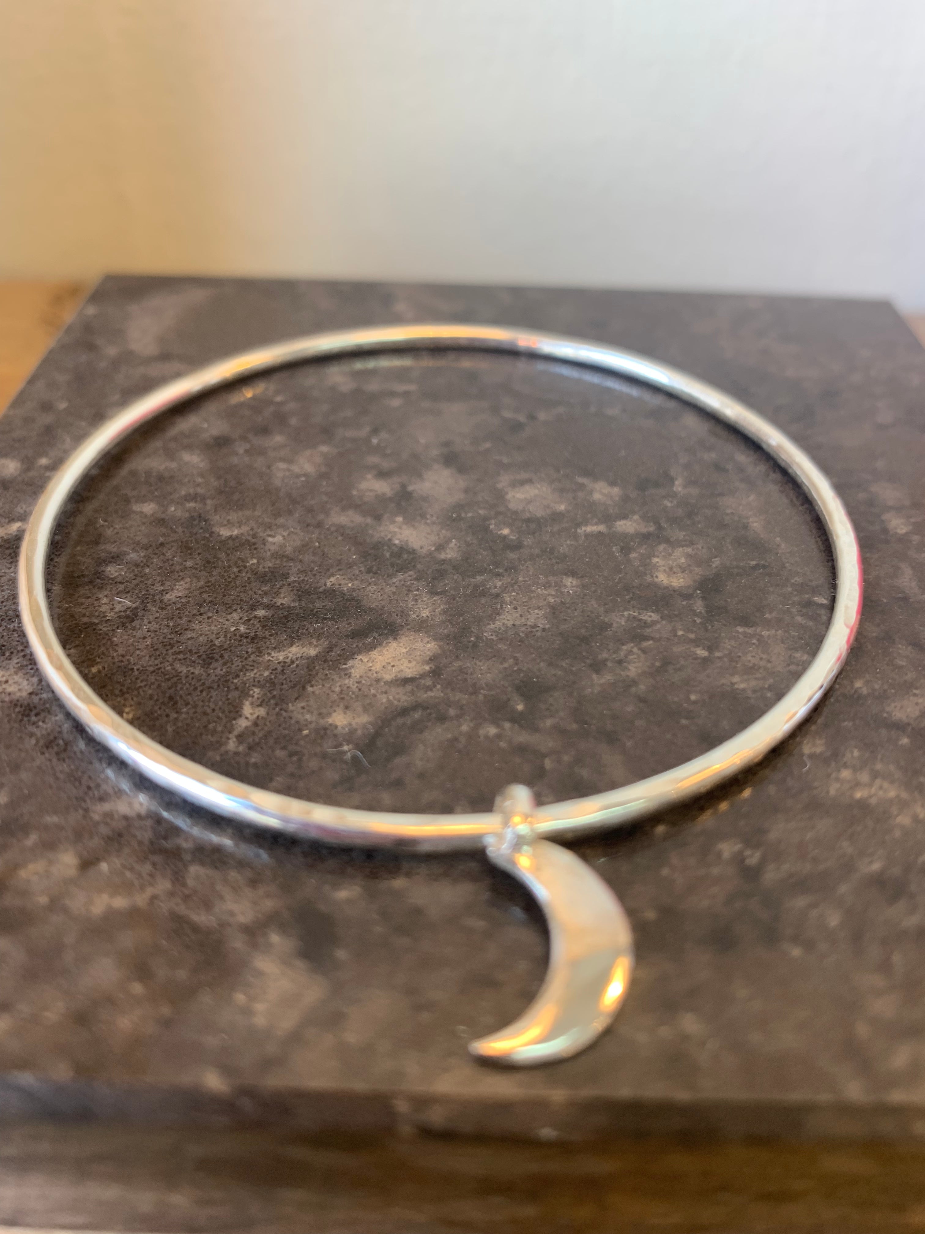 Belle & Bee 2mm hammered sterling silver bangle with a mini moon charm